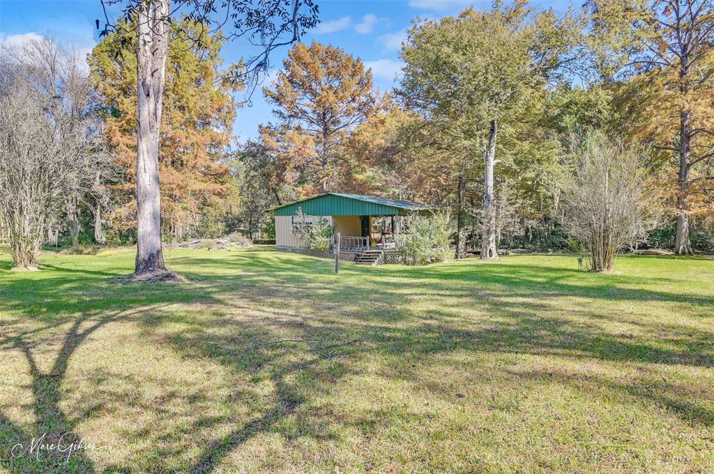 135 Poverty Point Doyline, LA 71023 - Photo 23 of 24 a front view of a house with a yard