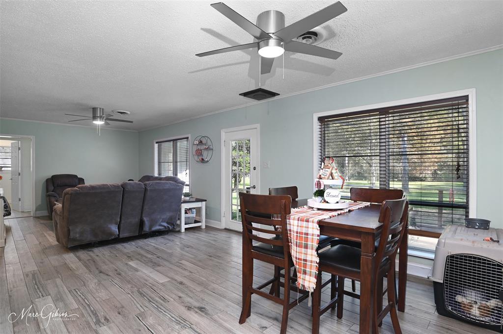 135 Poverty Point Doyline, LA 71023 - Photo 6 of 24 a view of a dining room with furniture window and wooden floor