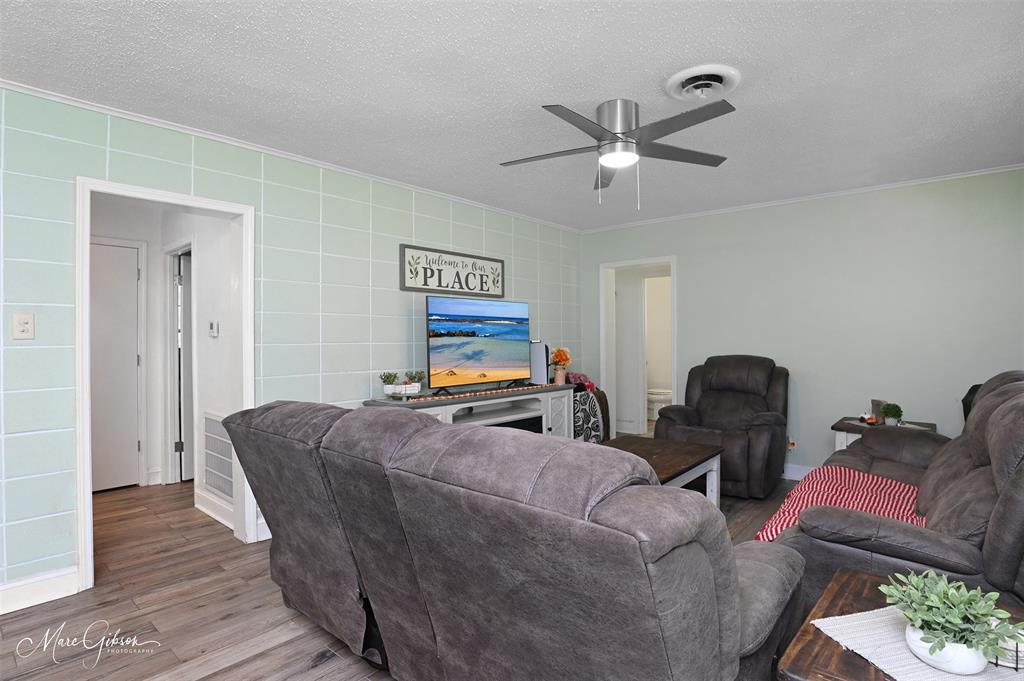 135 Poverty Point Doyline, LA 71023 - Photo 8 of 24 a living room with furniture and a chandelier