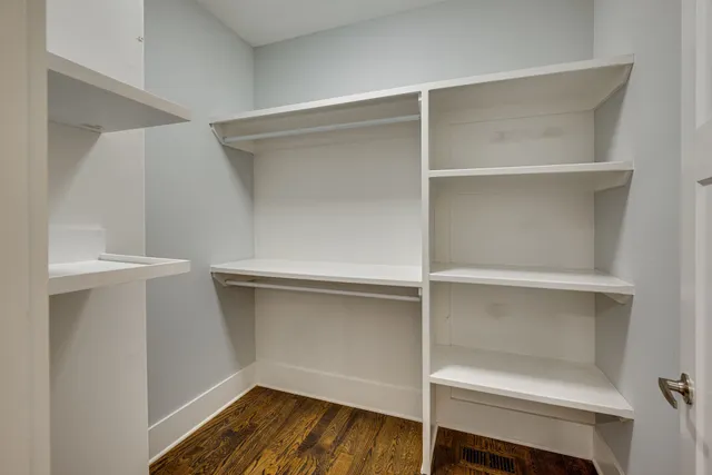 a view of an empty walk in closet