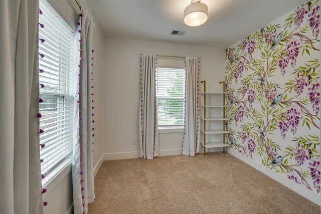 a view of empty room with windows