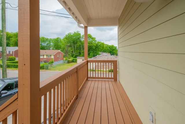 a view of balcony with wooden floor