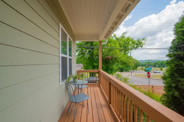 a view of balcony with furniture