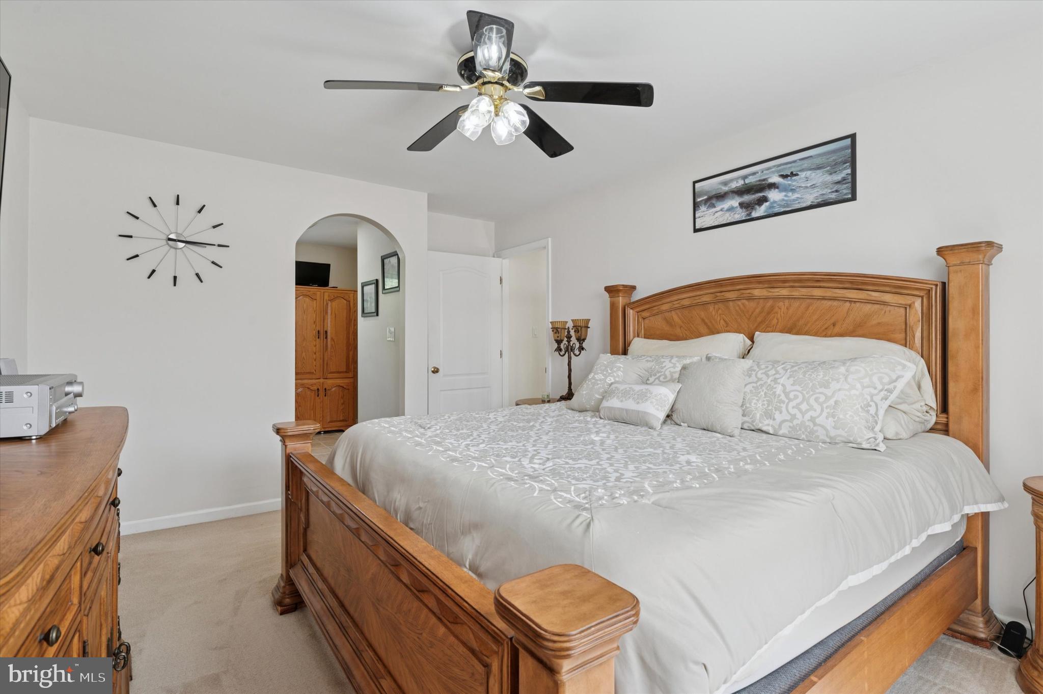 6 Crestpoint Drive New Castle, DE 19720 - Photo 20 of 36 a bedroom with a bed and a chandelier