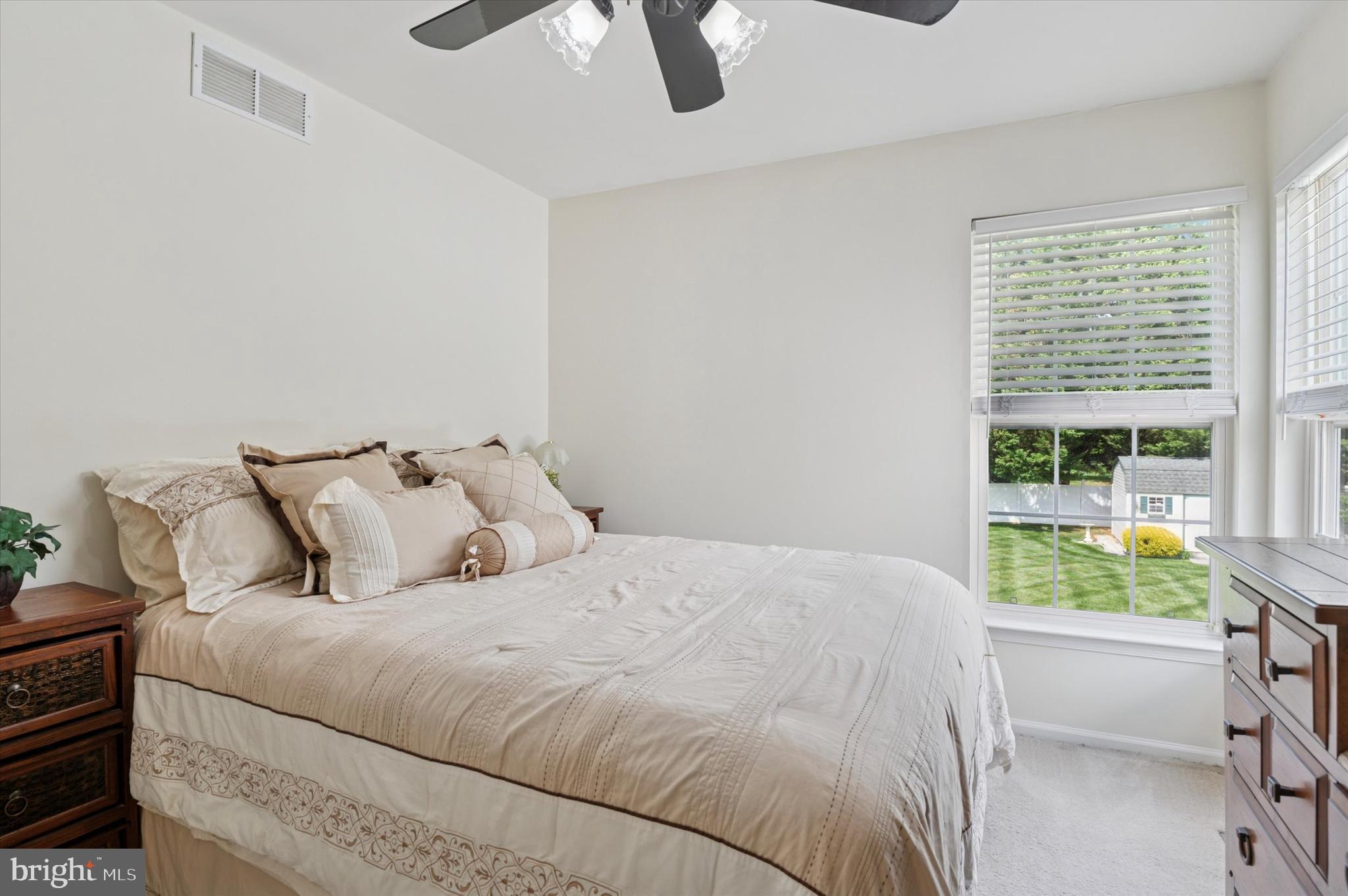 6 Crestpoint Drive New Castle, DE 19720 - Photo 26 of 36 a large bed sitting in a bedroom next to a window