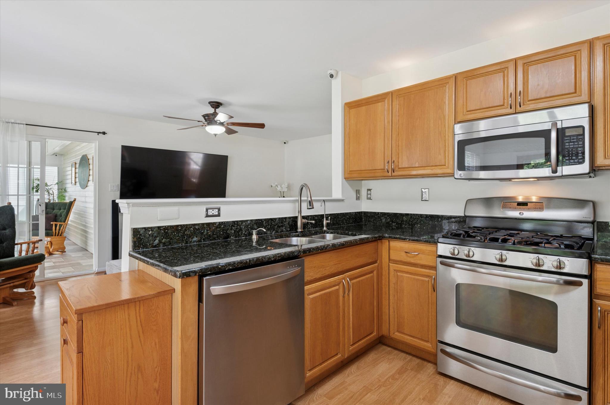 6 Crestpoint Drive New Castle, DE 19720 - Photo 7 of 36 a kitchen with stainless steel appliances a stove microwave and sink