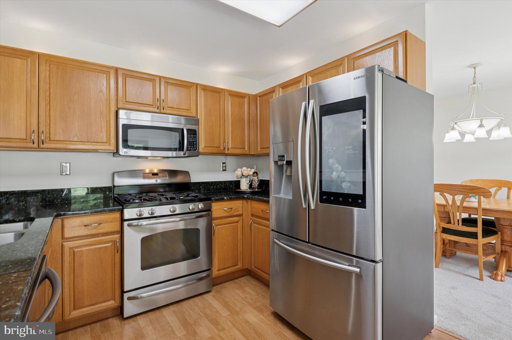 6 Crestpoint Drive New Castle, DE 19720 - Photo 10 of 36 a kitchen with stainless steel appliances a refrigerator stove and microwave