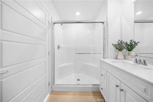 a bathroom with a shower and a sink