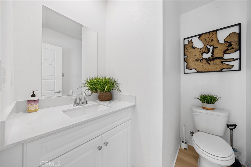 185 Steely Irvine, CA 92614 - Photo 18 of 35 a bathroom with a toilet a sink and mirror