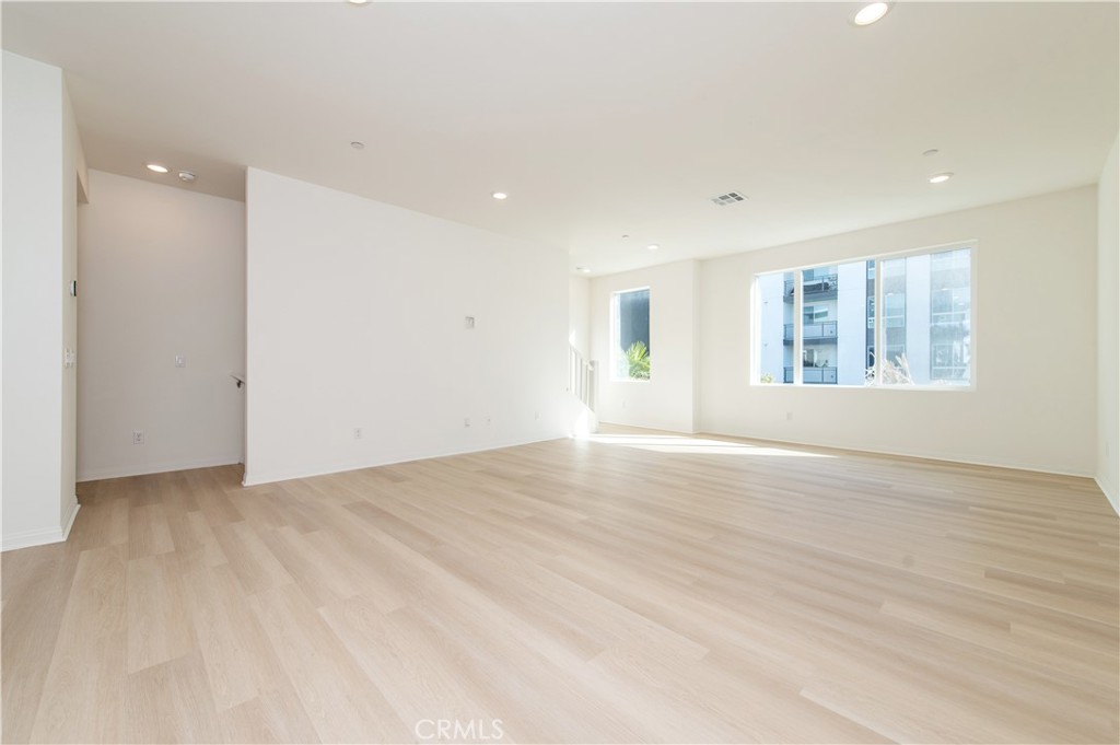 185 Steely Irvine, CA 92614 - Photo 23 of 35 an empty room with wooden floor and windows