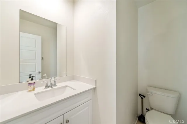 an empty room with wooden floor