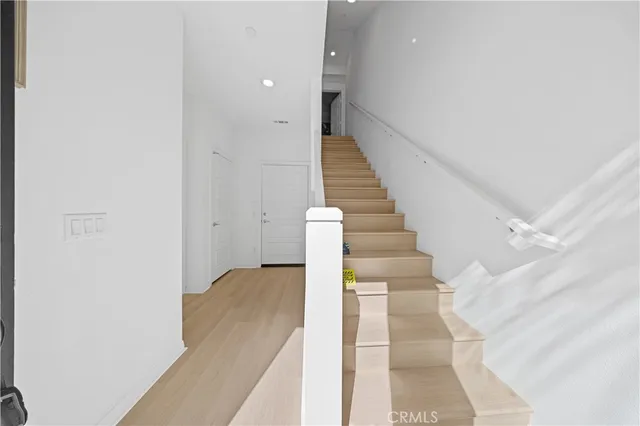 a view of staircase with white walls