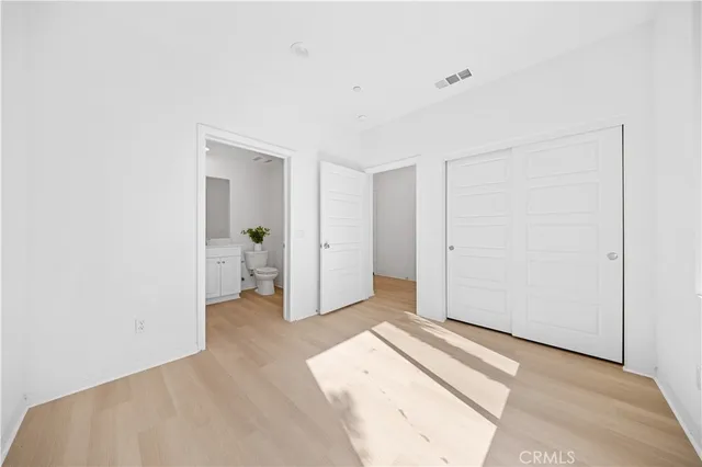 a view of livingroom with white walls and window