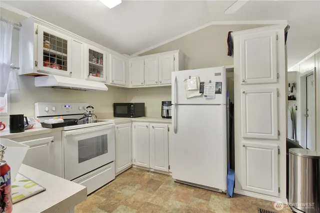 a white refrigerator freezer sitting inside of a kitchen