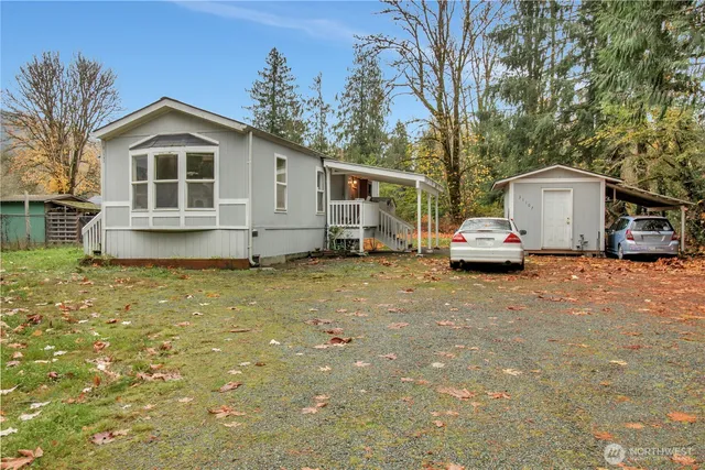 a large white house with a large white roof and a white house