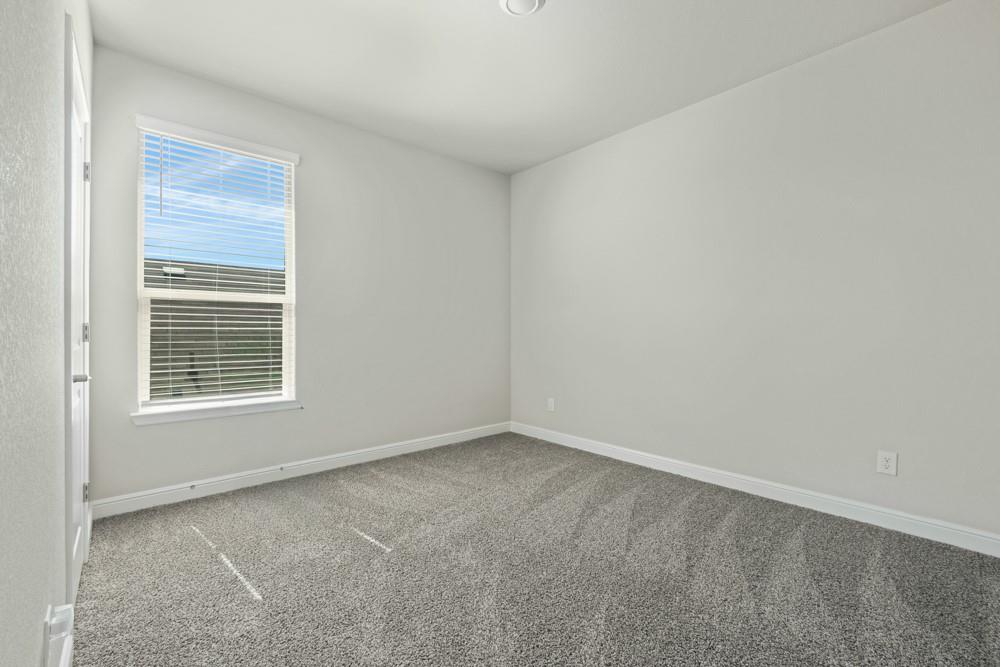1112 Croxley Way Justin, TX 76247 - Photo 10 of 18 Carpeted room featuring a single window with blinds, white walls, and white trim