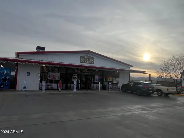 a view of a street with benches
