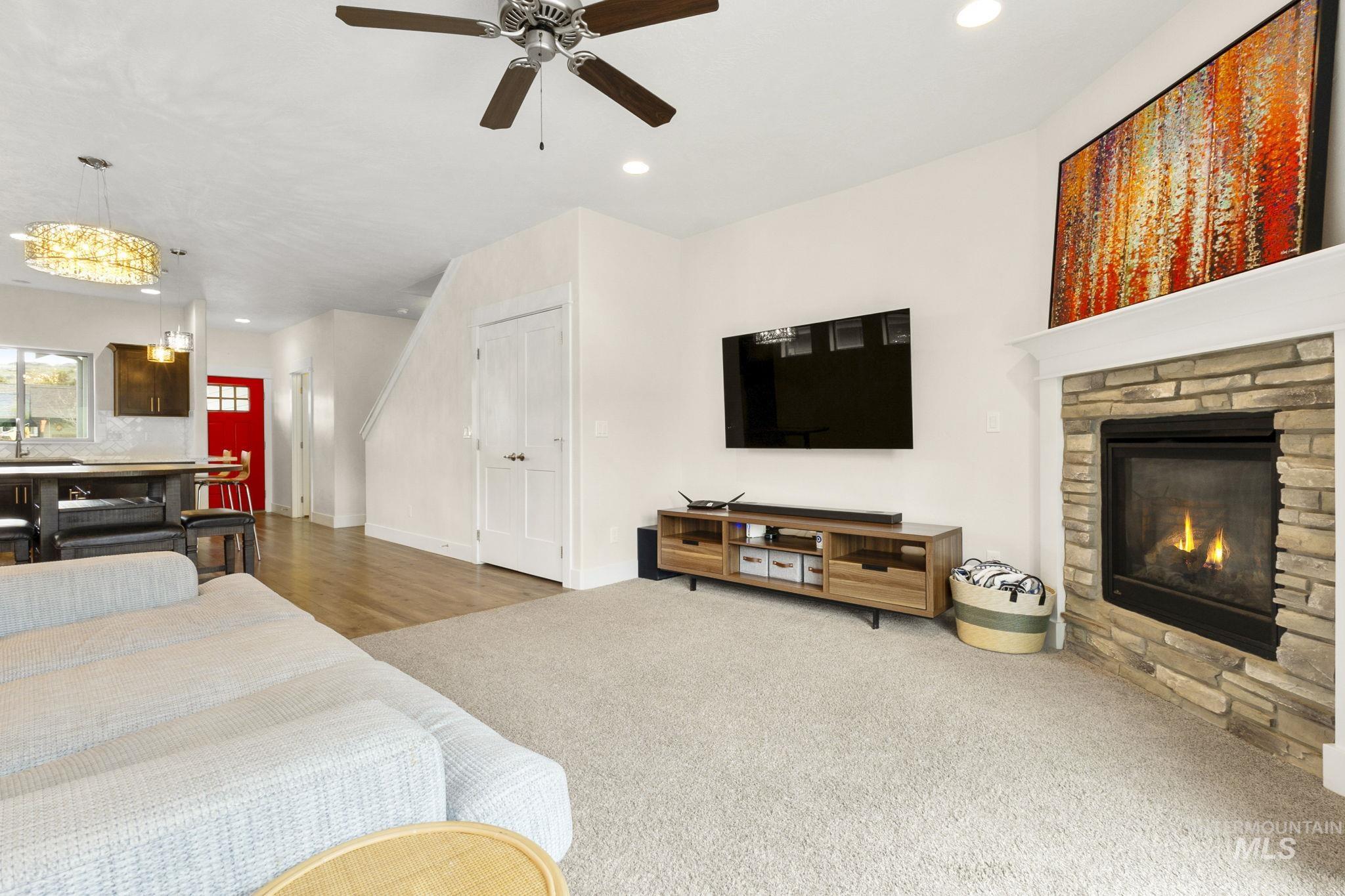 18293 North Streams Edge Way Boise, ID 83714 - Photo 9 of 50 Bedroom featuring recessed lighting, a fireplace, carpet flooring, and a ceiling fan