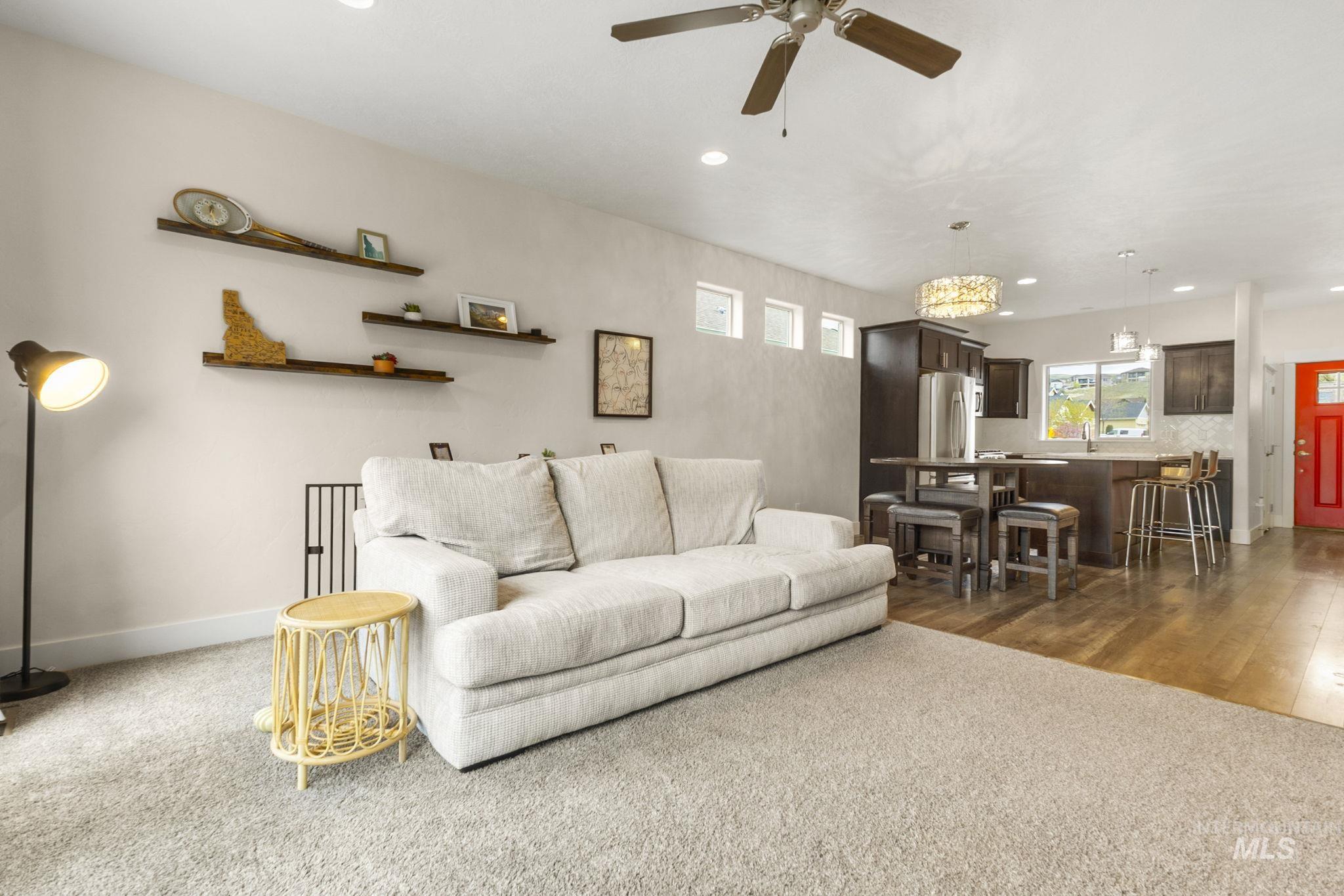 18293 North Streams Edge Way Boise, ID 83714 - Photo 11 of 50 Living area featuring a ceiling fan, dark colored carpet, and recessed lighting