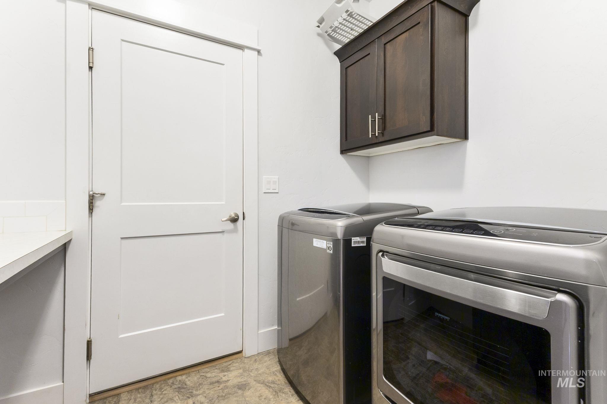 18293 North Streams Edge Way Boise, ID 83714 - Photo 15 of 50 Laundry room with washing machine and dryer and cabinet space