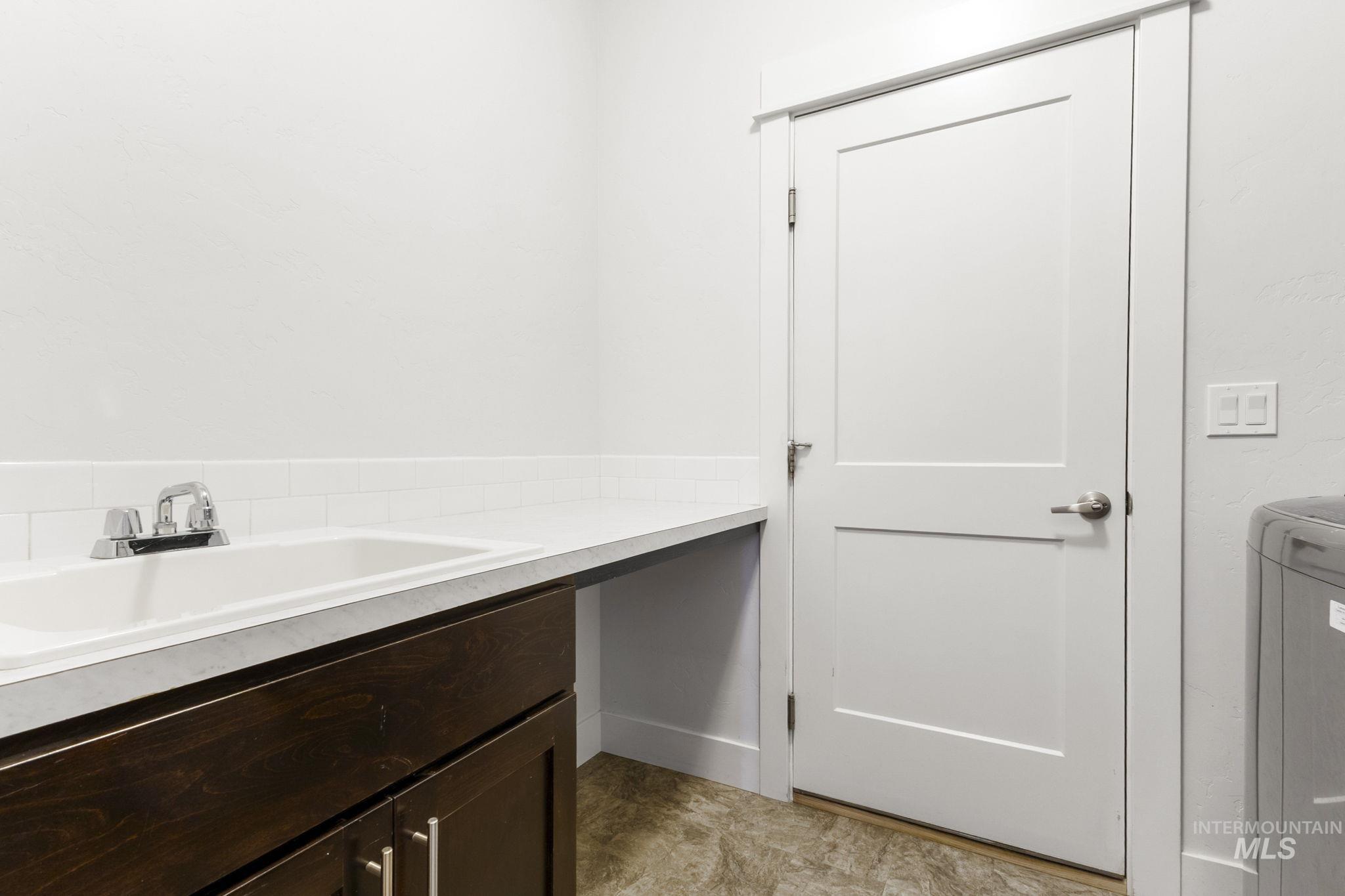 18293 North Streams Edge Way Boise, ID 83714 - Photo 16 of 50 Bathroom featuring vanity and washer / clothes dryer