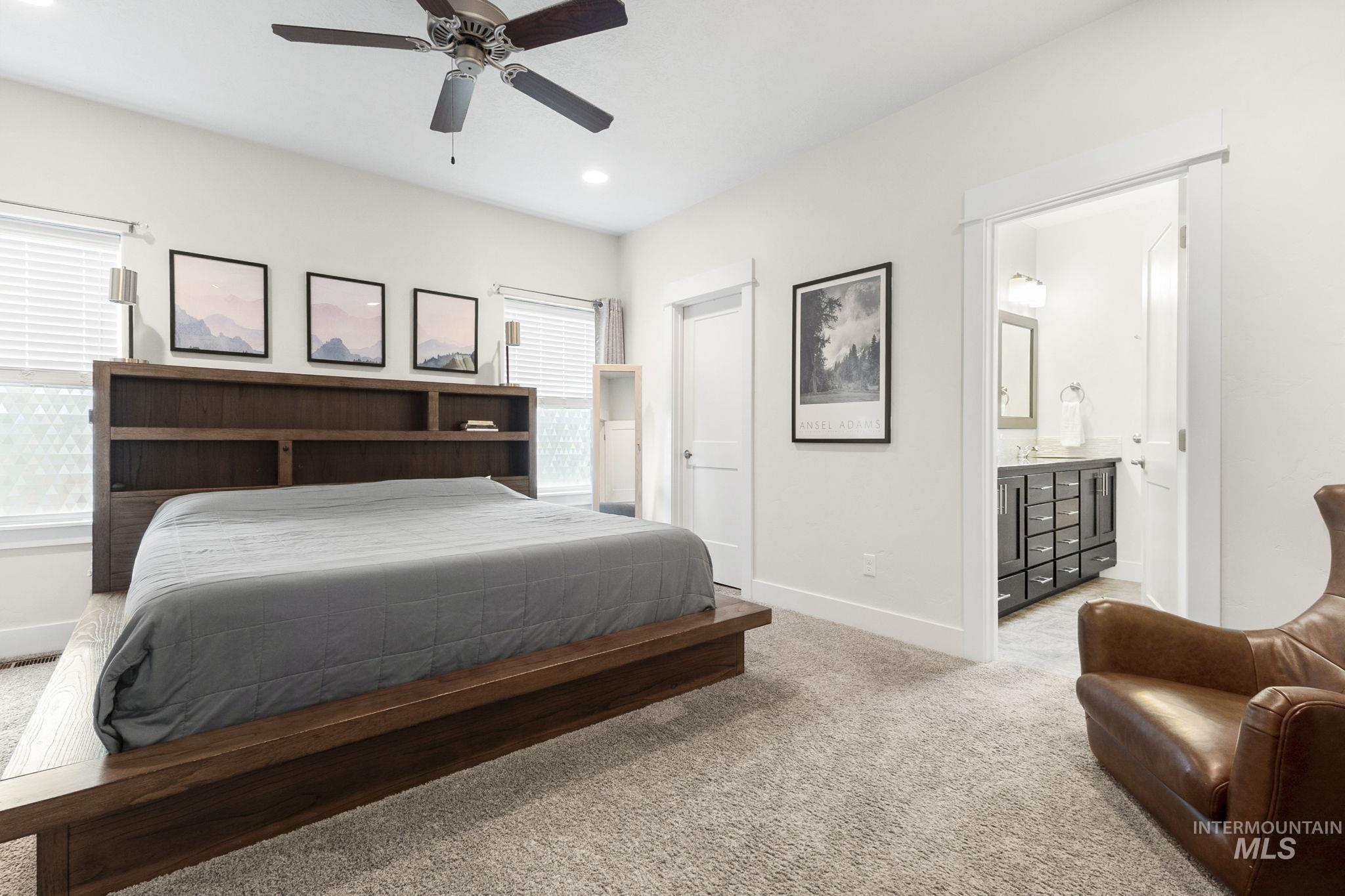 18293 North Streams Edge Way Boise, ID 83714 - Photo 17 of 50 Bedroom with light carpet, a ceiling fan, and connected bathroom