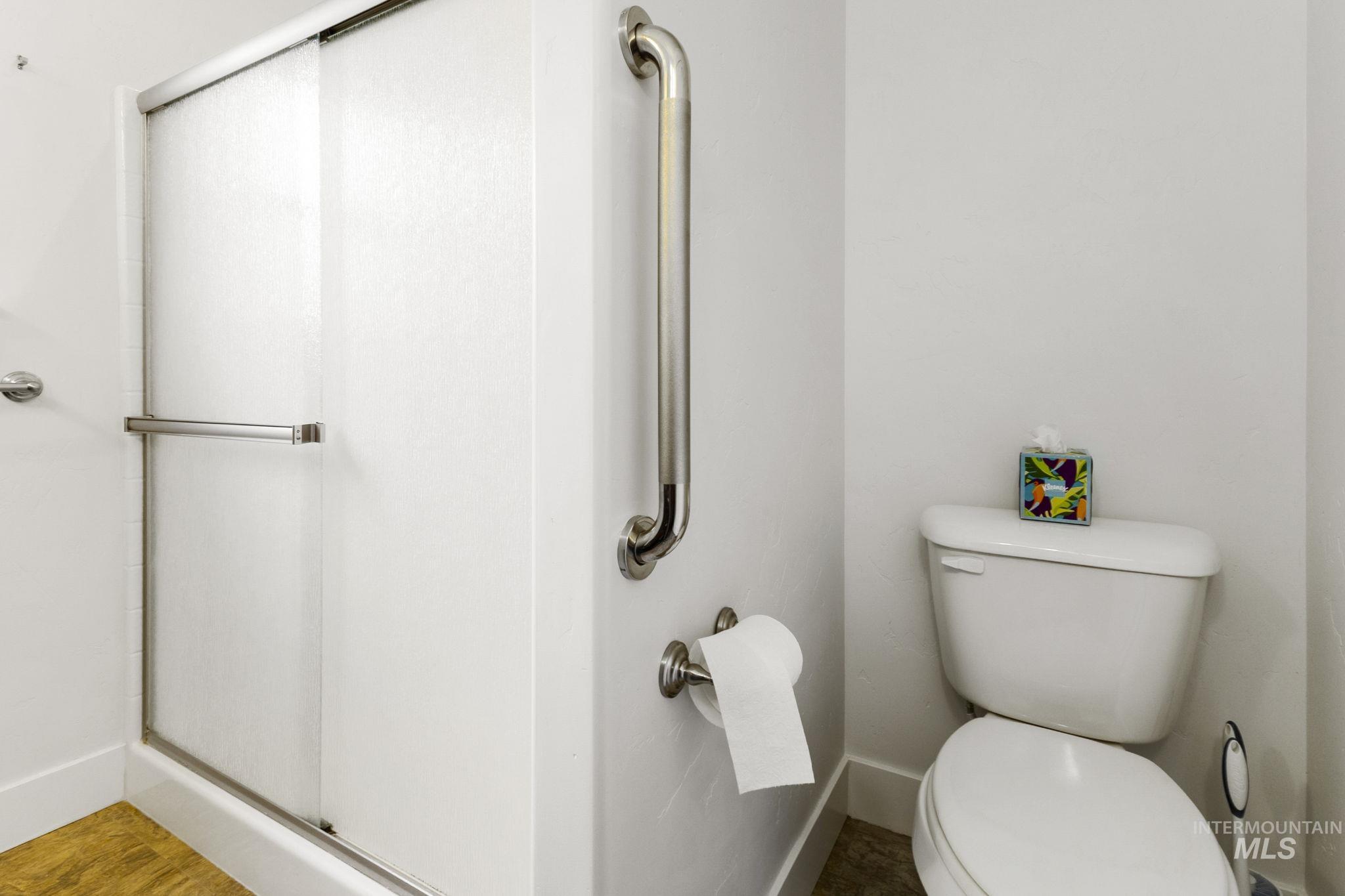 18293 North Streams Edge Way Boise, ID 83714 - Photo 22 of 50 Full bathroom featuring a stall shower and toilet