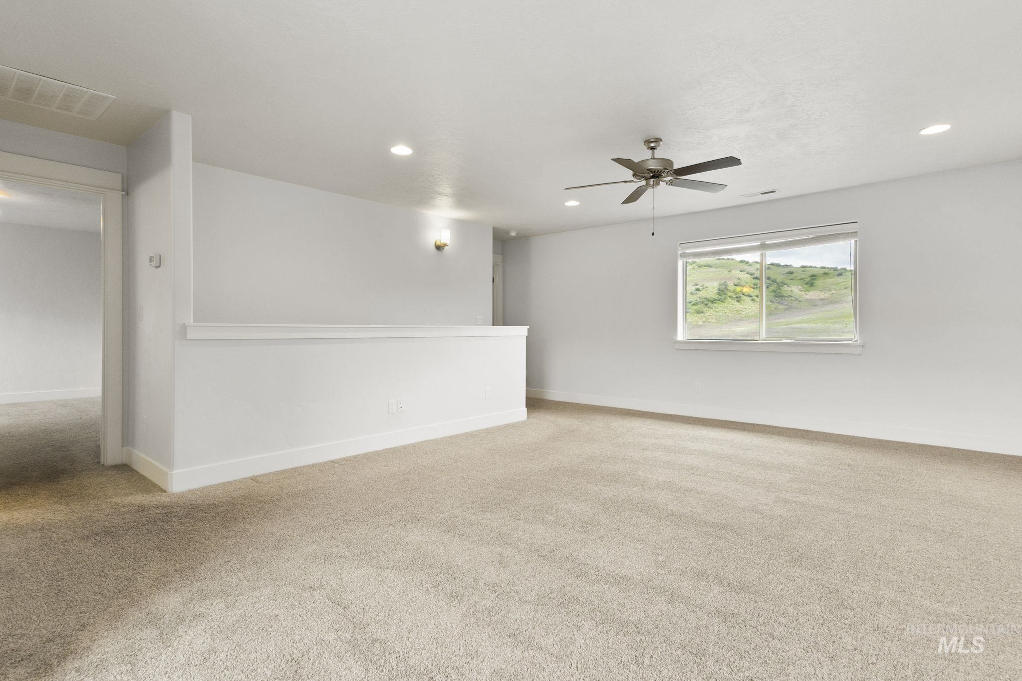18293 North Streams Edge Way Boise, ID 83714 - Photo 25 of 50 Spare room featuring carpet, ceiling fan, and recessed lighting