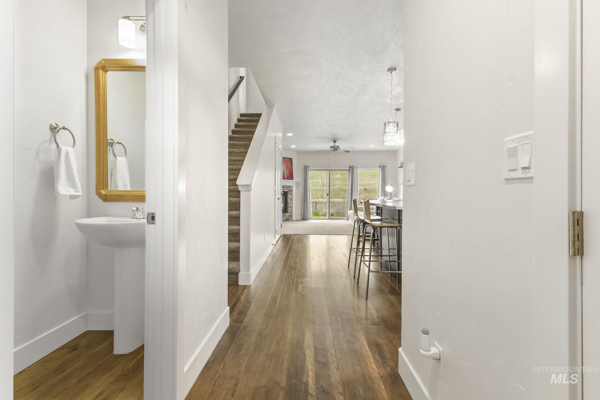 18293 North Streams Edge Way Boise, ID 83714 - Photo 3 of 50 Corridor with dark wood-style flooring and recessed lighting