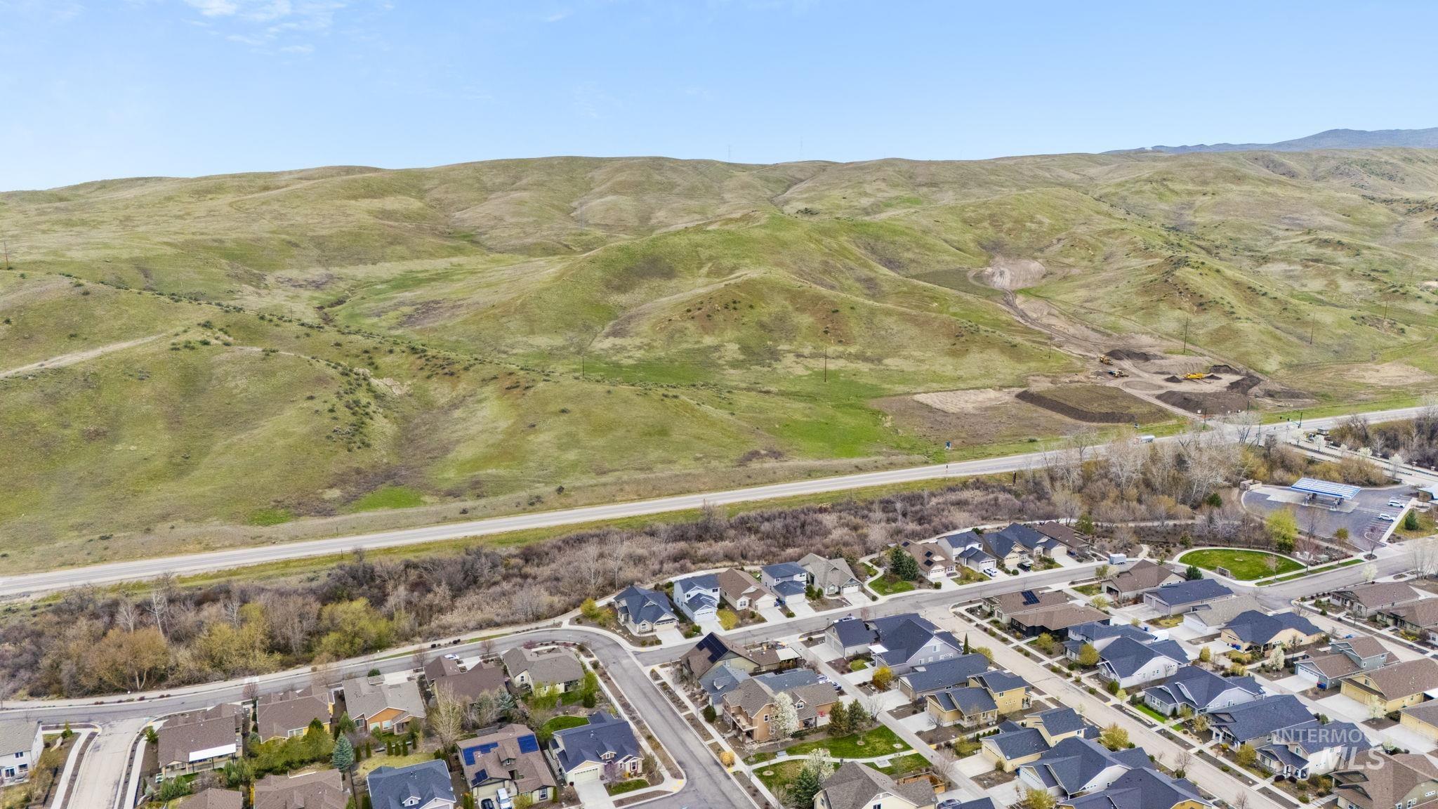 18293 North Streams Edge Way Boise, ID 83714 - Photo 45 of 50 Aerial perspective of suburban area featuring mountains
