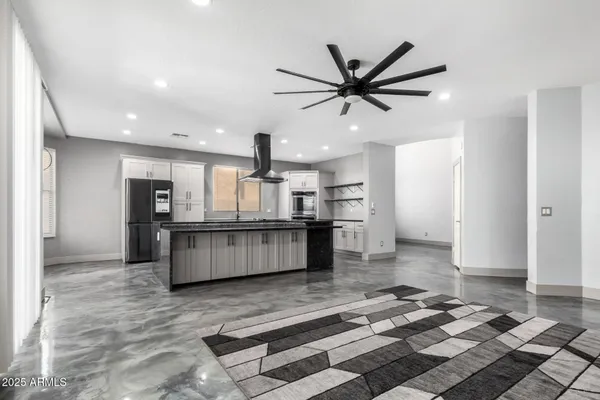 a kitchen with granite countertop a sink and stove