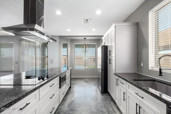 a view of a kitchen with a sink
