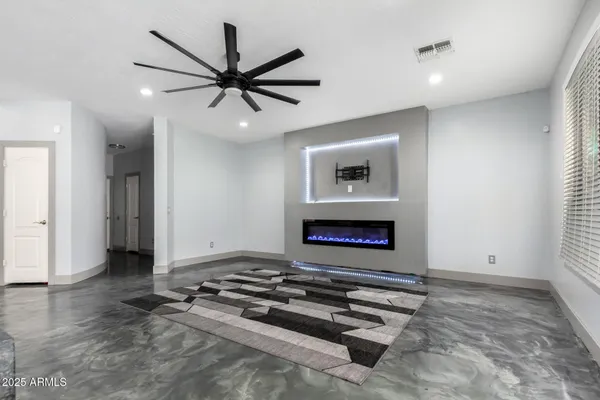 a view of an empty room and fire place