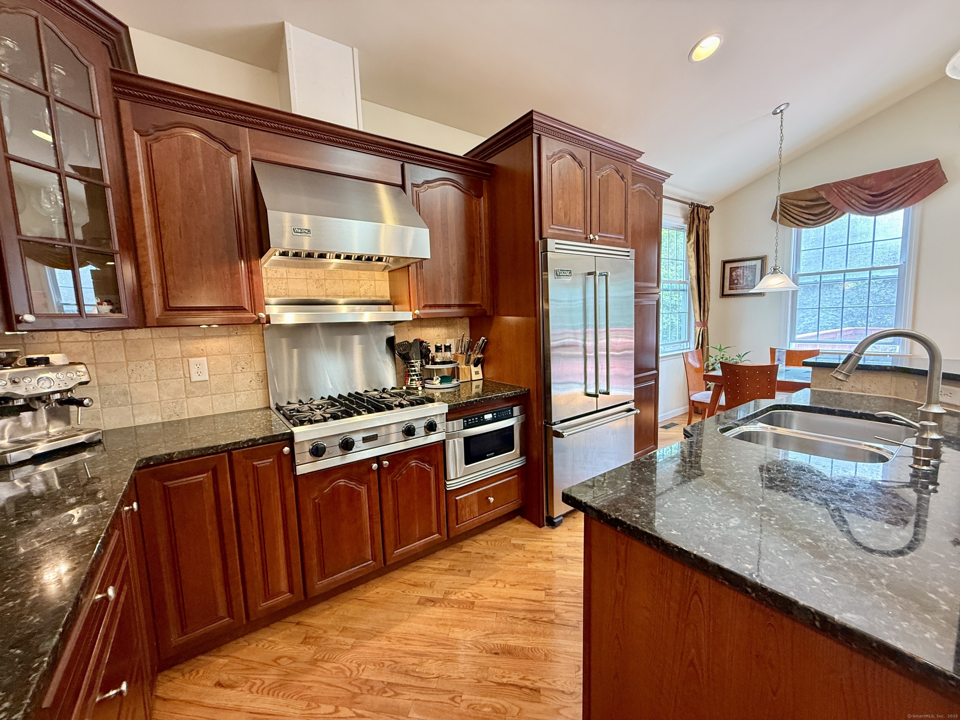 18 Fieldstone Lane, Unit 18 Beacon Falls, CT 06403 - Photo 12 of 40 a kitchen with stainless steel appliances granite countertop a sink stove and refrigerator