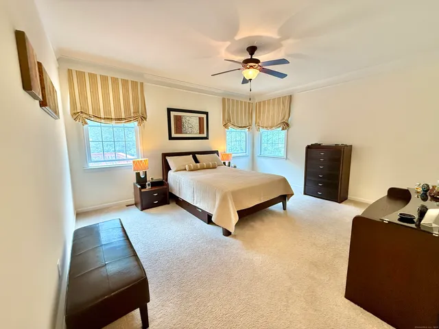 a bedroom with a bed and a couch