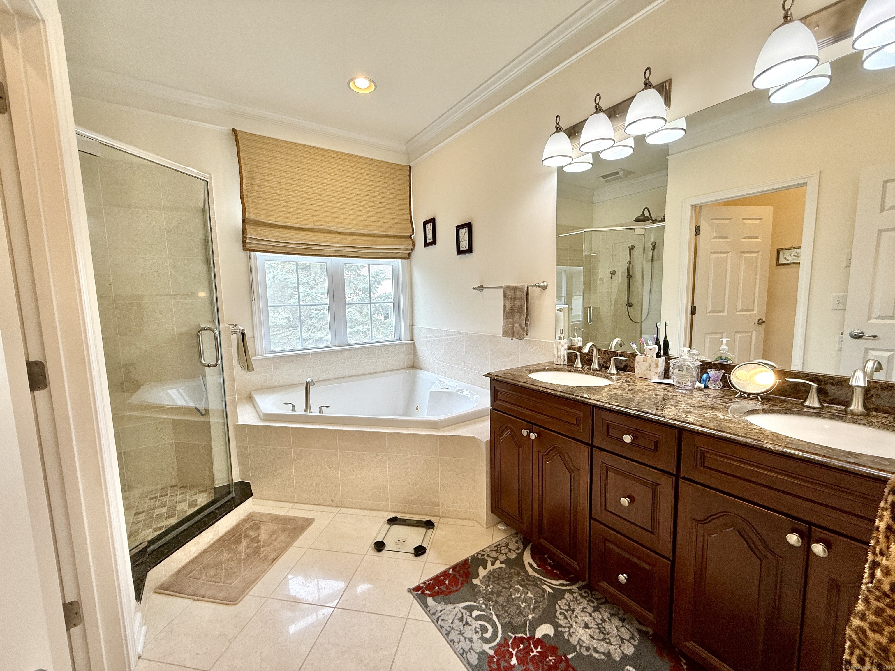 18 Fieldstone Lane, Unit 18 Beacon Falls, CT 06403 - Photo 25 of 40 a spacious bathroom with a tub sink and mirror