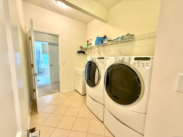 a view of a storage & utility room with washer and dryer