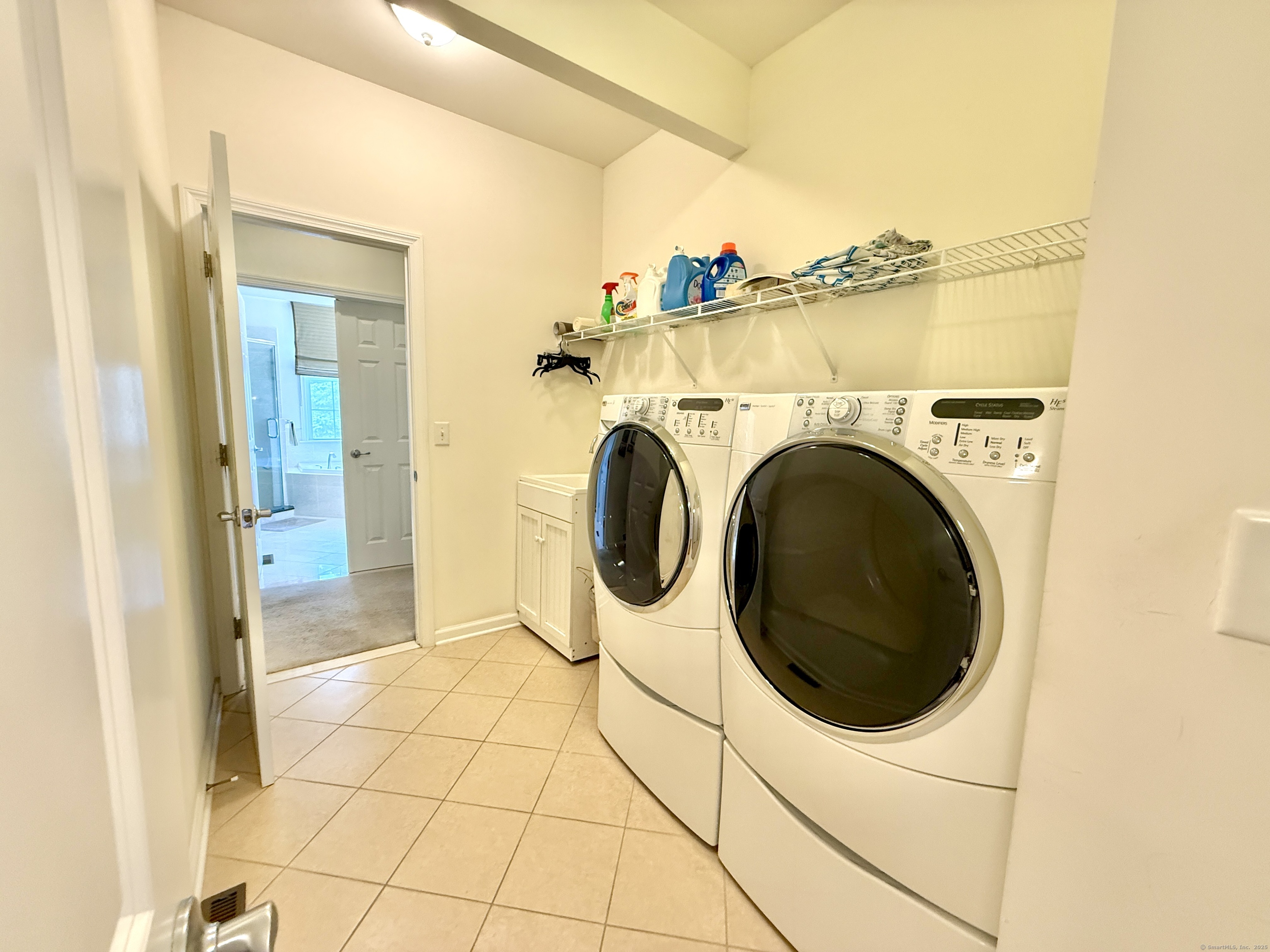 18 Fieldstone Lane, Unit 18 Beacon Falls, CT 06403 - Photo 28 of 40 a view of a storage & utility room with washer and dryer