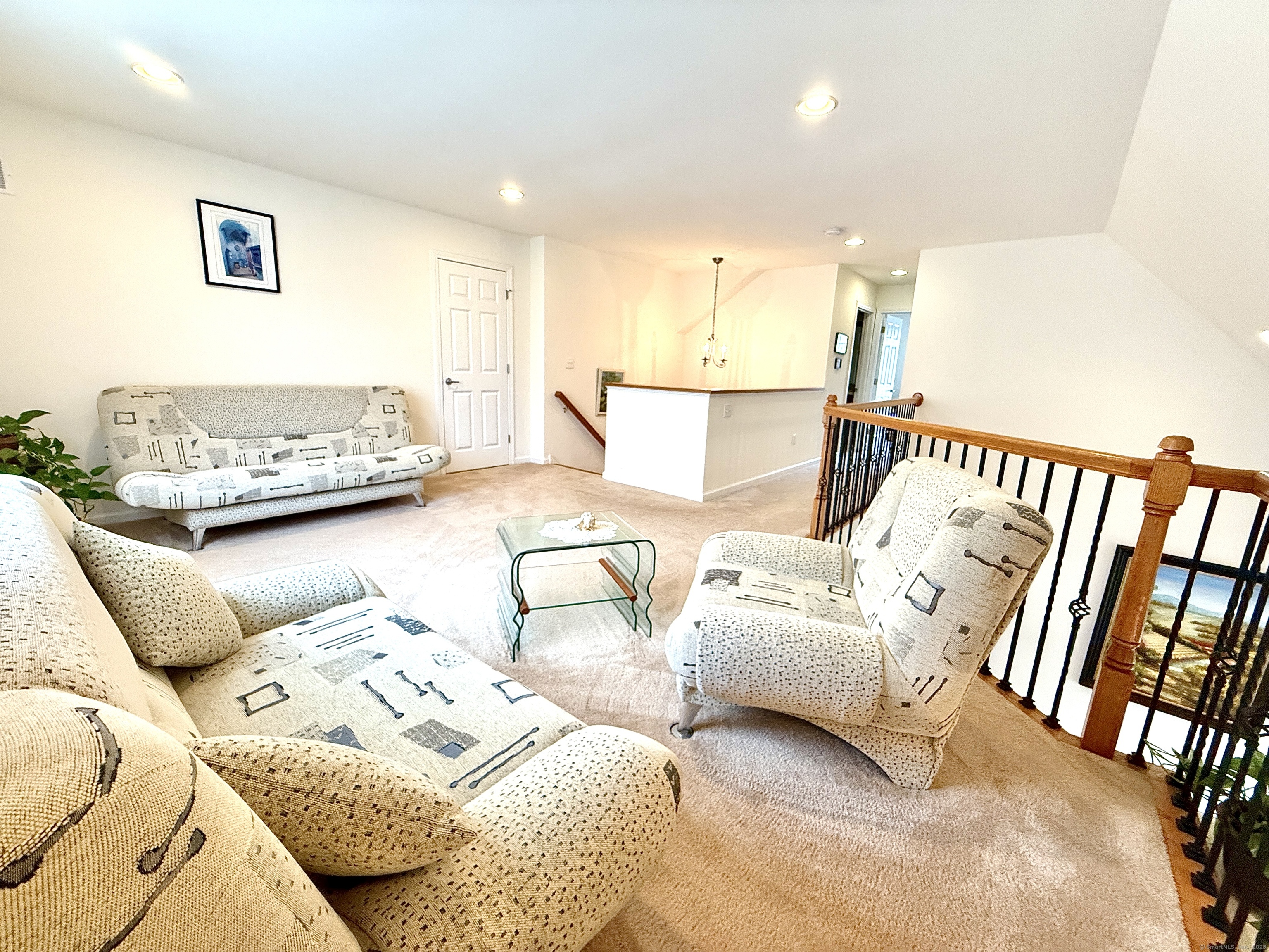 18 Fieldstone Lane, Unit 18 Beacon Falls, CT 06403 - Photo 33 of 40 a spacious bedroom with a bed and a couch