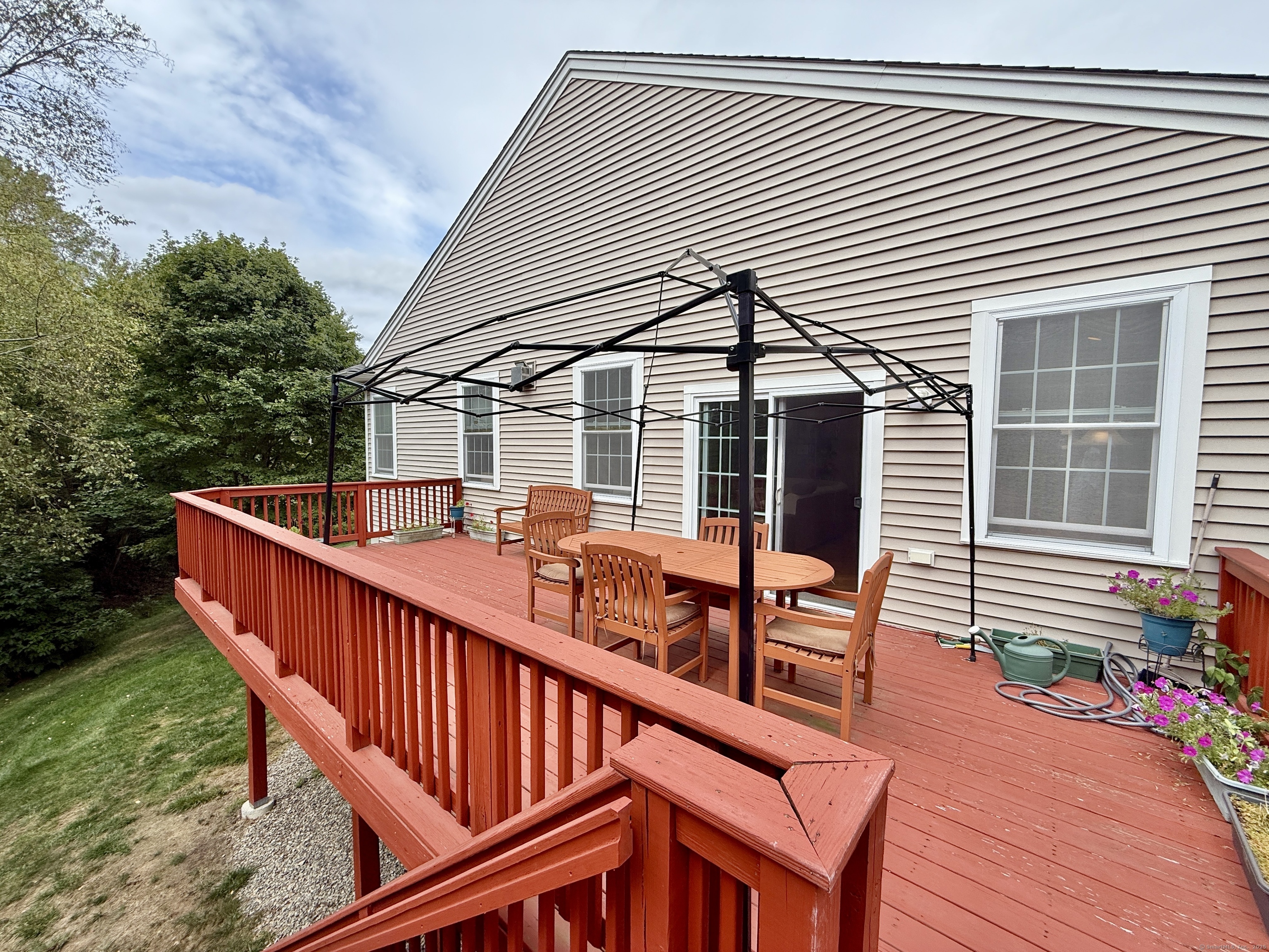 18 Fieldstone Lane, Unit 18 Beacon Falls, CT 06403 - Photo 37 of 40 a view of a house with backyard and deck