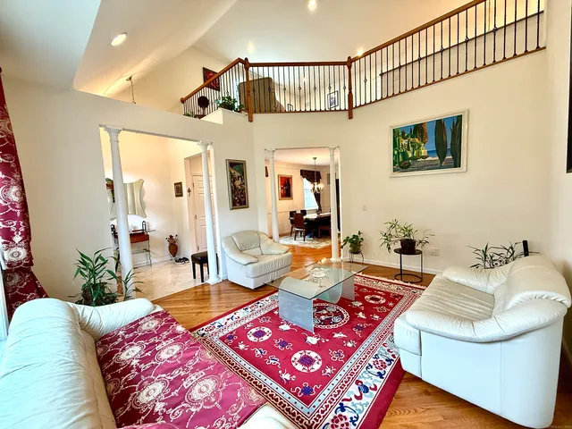 a living room with furniture and a rug