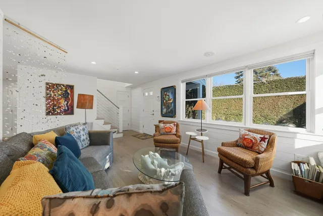 a view of a dining room with furniture and window