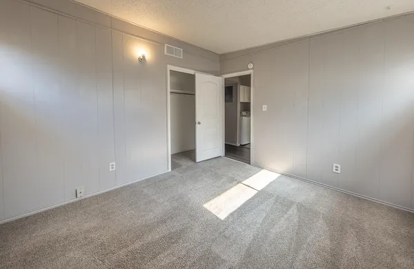 a view of an empty room and window