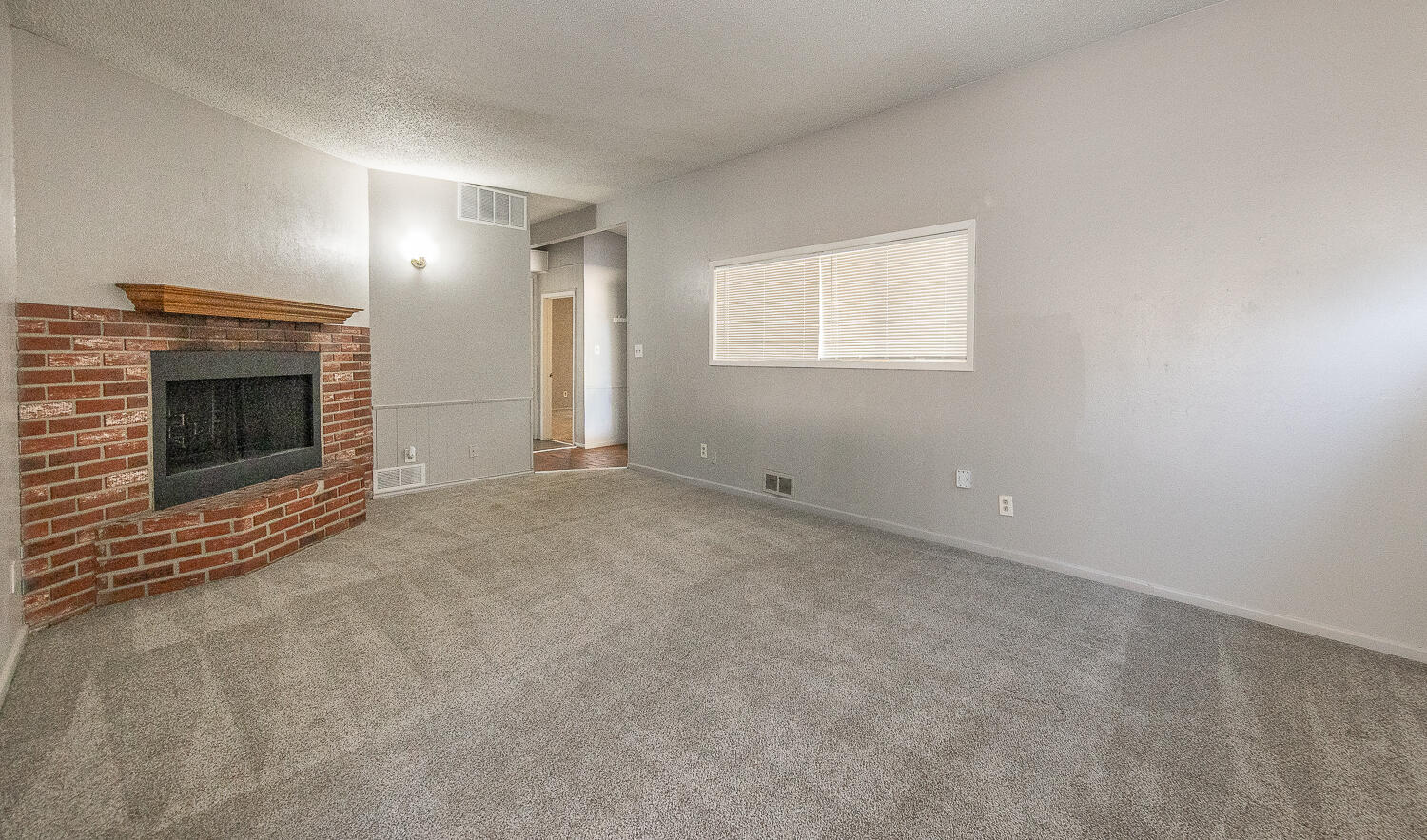 4409 44th Street Lubbock, TX 79414 - Photo 6 of 22 a view of empty room with a fireplace
