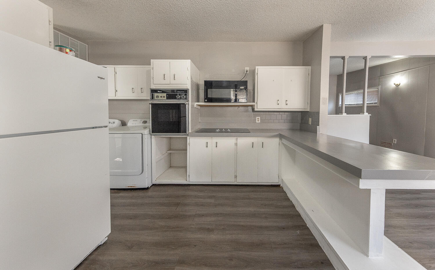 4409 44th Street Lubbock, TX 79414 - Photo 10 of 22 a view of a kitchen with stainless steel appliances a refrigerator and a sink