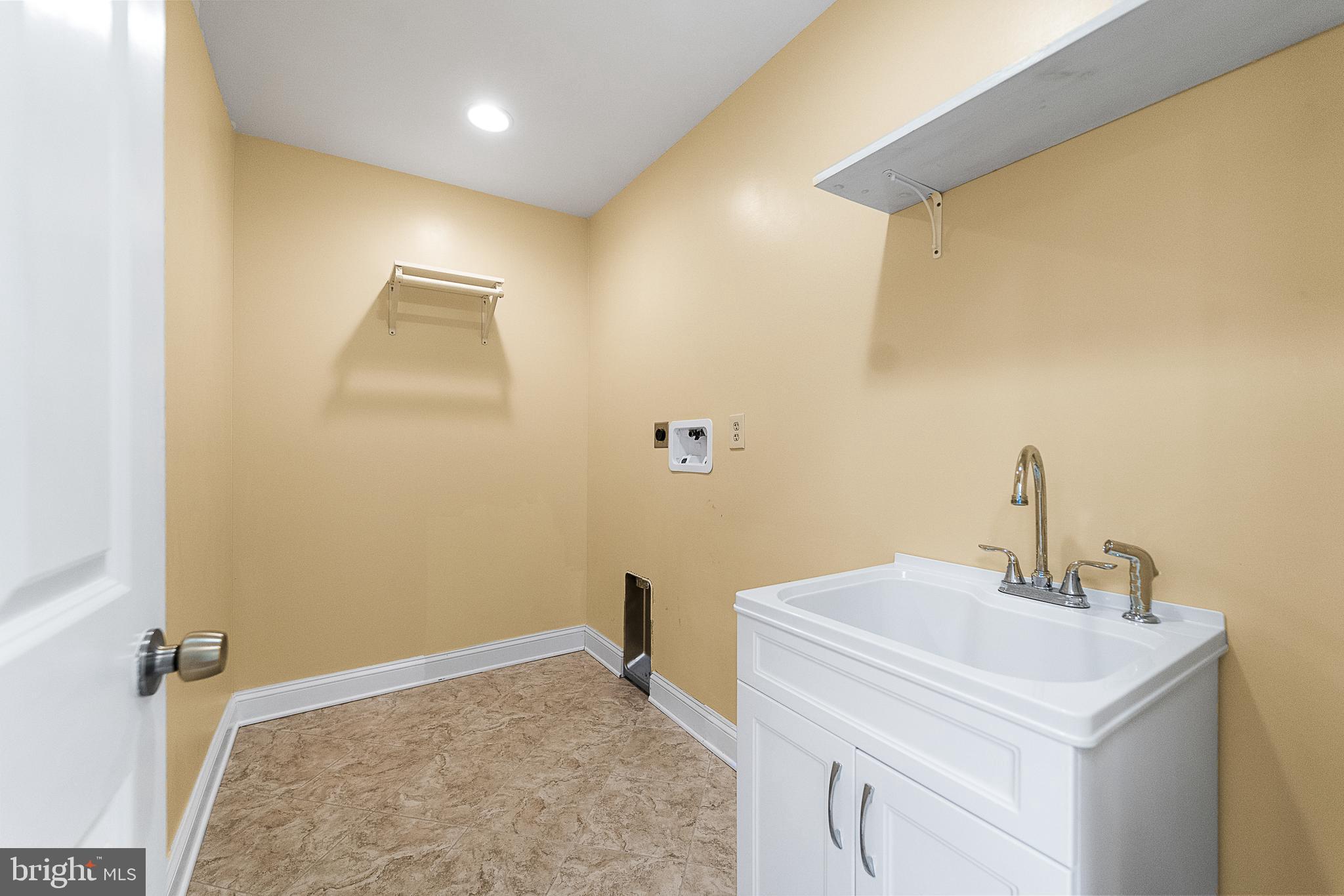 8149 Orchard Point Road Pasadena, MD 21122 - Photo 30 of 37 Laundry room upstairs