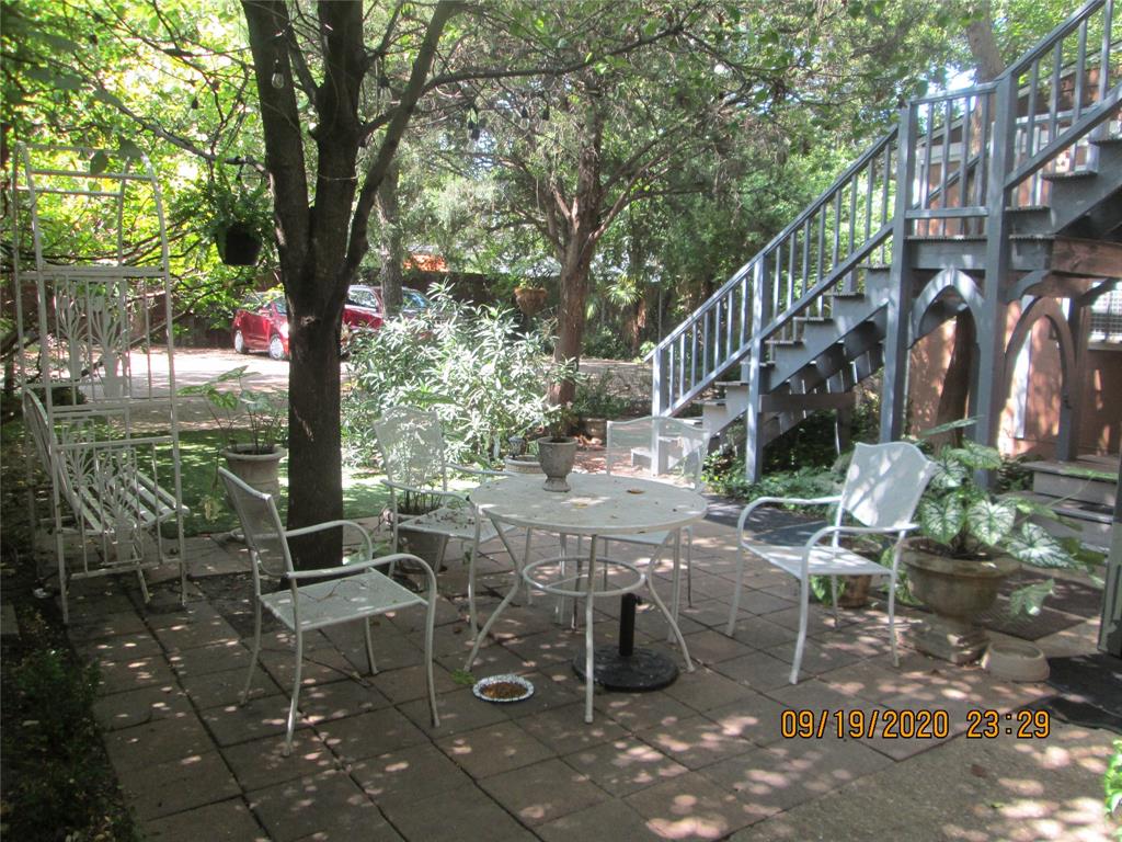 203 North Colson Street, Unit 4 Dallas, TX 75246 - Photo 14 of 15 View of patio featuring stairway