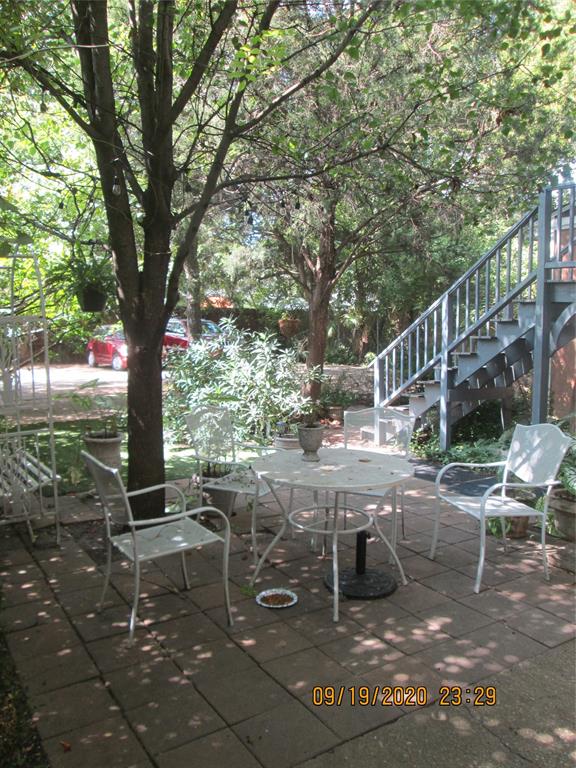 203 North Colson Street, Unit 4 Dallas, TX 75246 - Photo 15 of 15 View of patio with stairs and outdoor dining space
