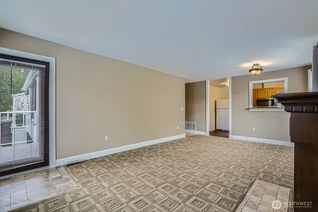 a kitchen with a stove a sink and a microwave