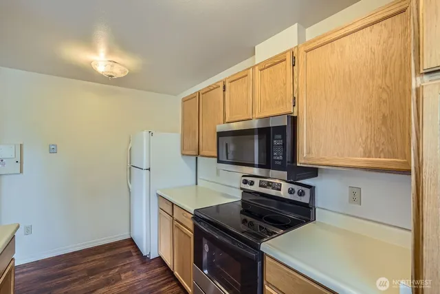 a living room with furniture flat screen tv and a fireplace